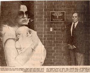 Newspaper photo of Chief Bragdon and Patti Michelli on the right